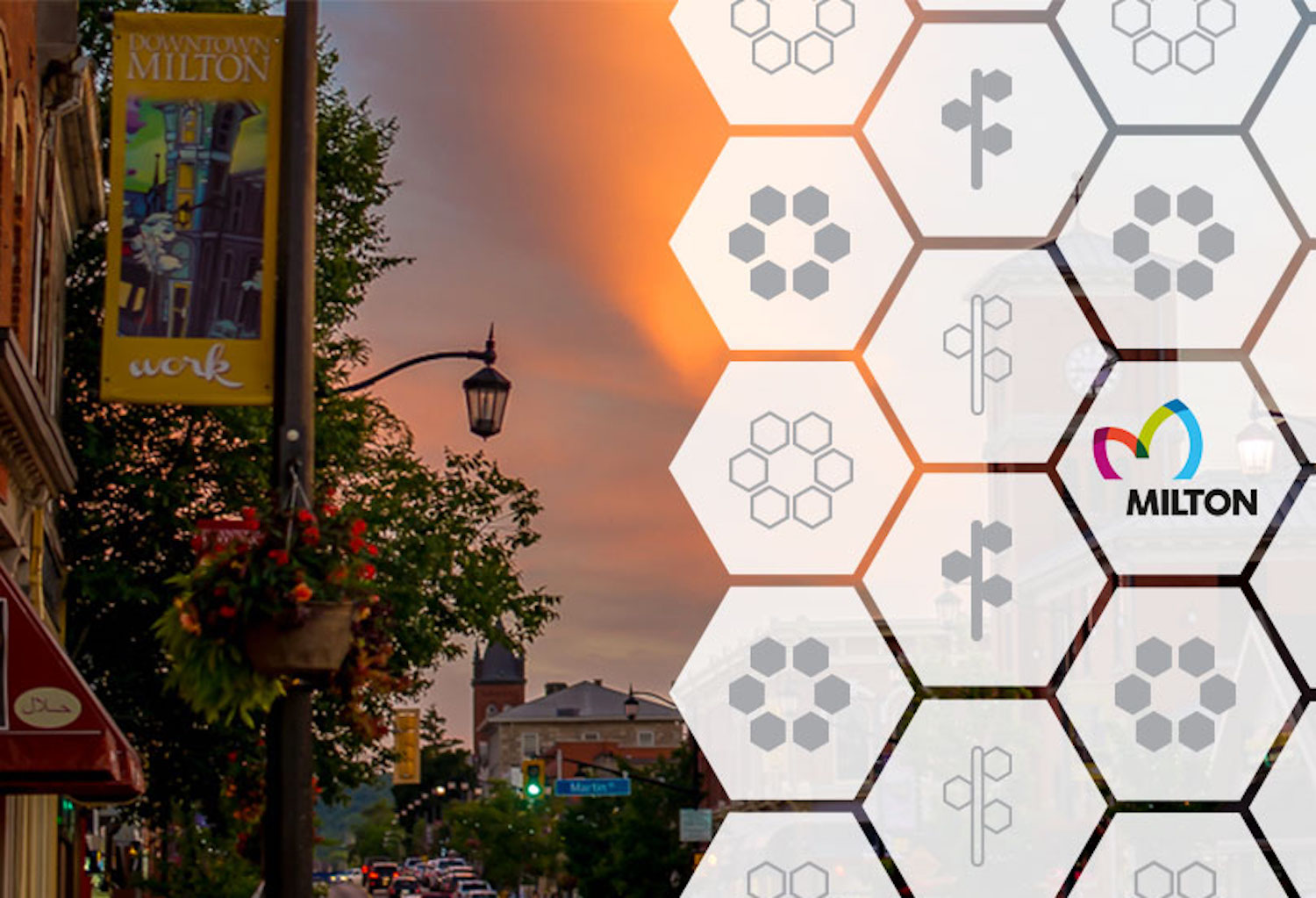 A shot of Milton's main street covered with transparent vector hexagons with various icons on them